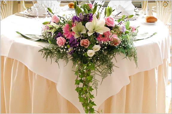  pastel arrangement too but bigger with a long ivy train to match table 