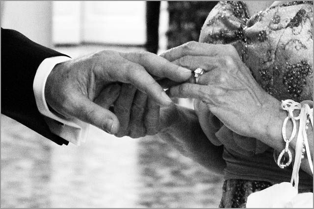 Bride and groom exchanging rings Italy