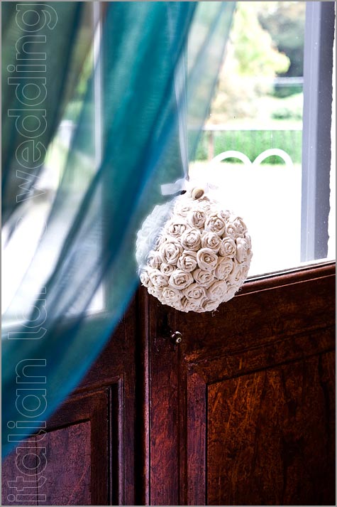 From bride's house to the church Many little fabric roses balls on a rubber