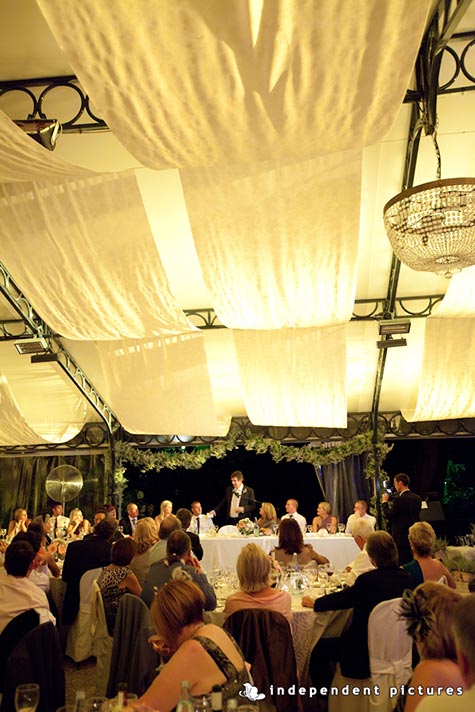  Laura and Craig's wedding - September 2011 Reception in the wonderful pavilion with special light set. Speeches moment with wonderful frame of baby's breath garland - Photo by Independent Pictures