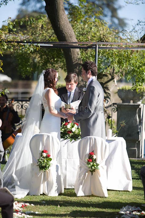  Joanna and Matt - September 2012 A very sweet detail of the blessing in the gardens of the villa - bride and groom exchanging their vows. - Photo by Alfonso Longobardi