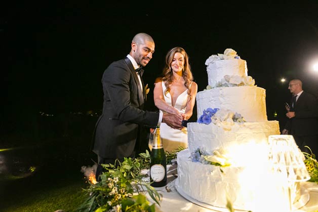 wedding cake cut overlooking Lake Como
